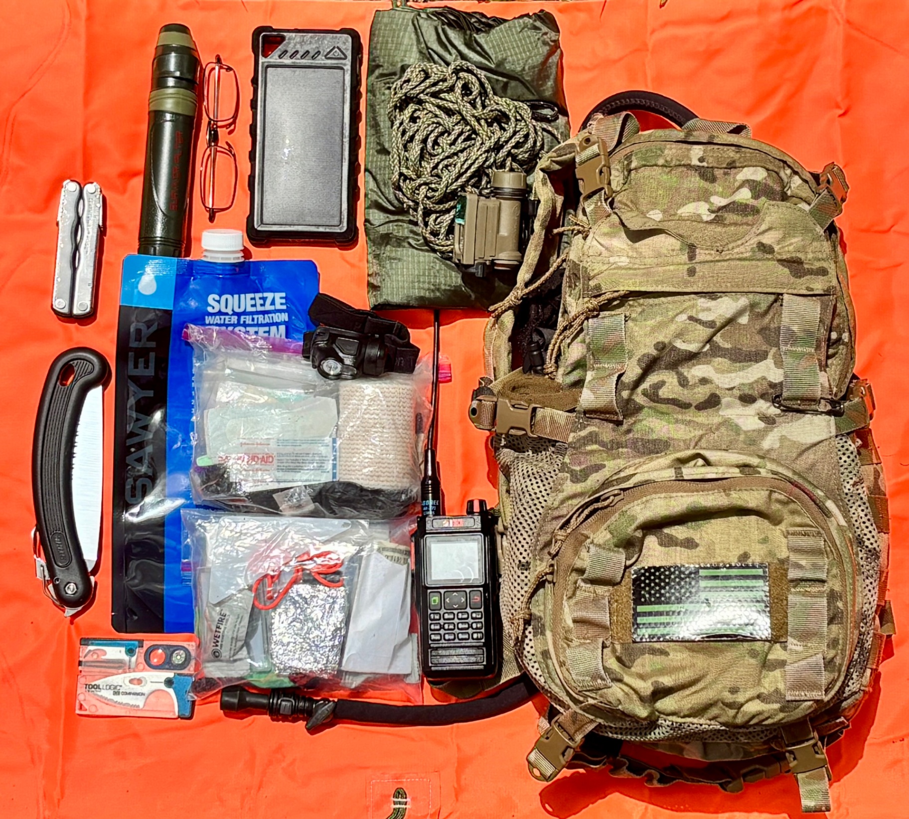 Tactical go bag with organized emergency preparedness gear